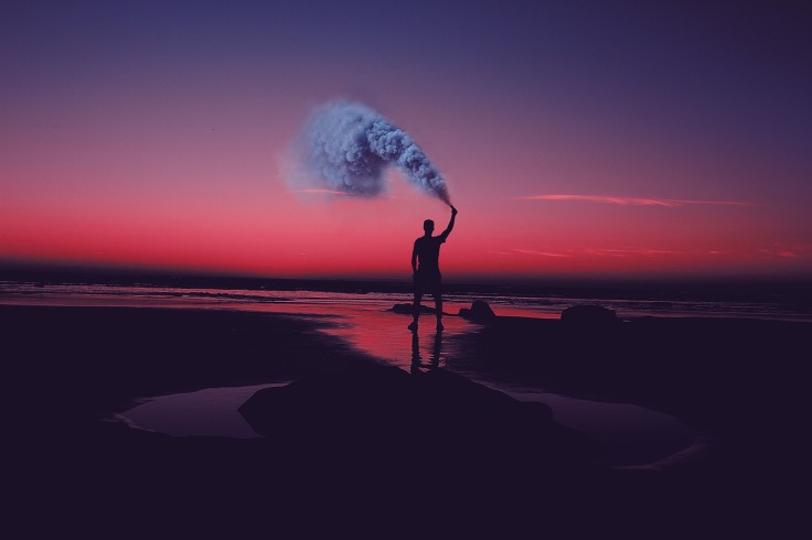 Man w Smoke Flare Beach